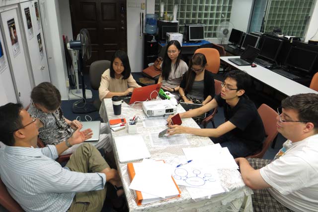 TWC2's Yew Kong Loeng explaining a point to (second from left) Pat Meyer (TWC2), Kyi Lai Lai Shoon, Shi Xiaomeng and Soe Myat Myat Aung Htut (Team Creovate), Ong Chin Kiat and Miguel Pina (TWC2). Not in photo: Nyein Su Aye (Creovate), Robin Rheaume and Akex Au (TWC2) 